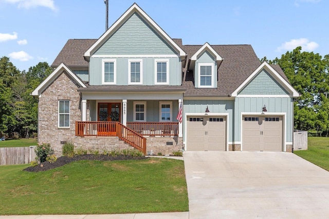 8665 Woodbury Acre Ct, Harrison, TN 37341 - craftsman inspired home with board and batten siding, driveway, covered porch, a garage, and a shingled roof