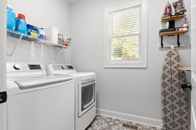 8665 Woodbury Acre Ct, Harrison, TN 37341 - laundry area with washer and dryer and tile patterned floors
