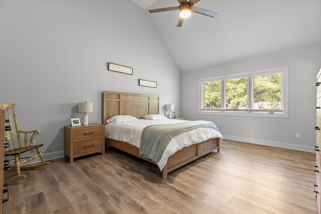 8665 Woodbury Acre Ct, Harrison, TN 37341 - bedroom with high vaulted ceiling, light wood finished floors, and a ceiling fan