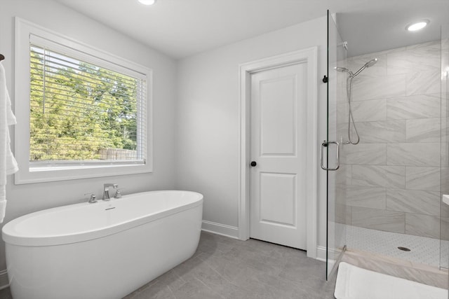 8665 Woodbury Acre Ct, Harrison, TN 37341 - full bath featuring a soaking tub, a shower stall, and recessed lighting