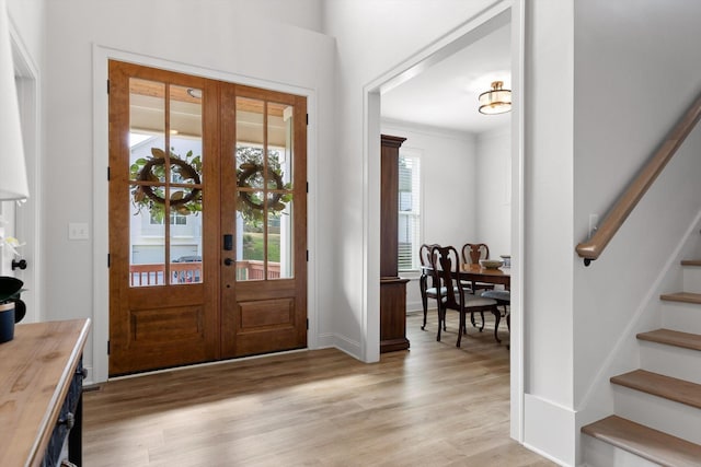 8665 Woodbury Acre Ct, Harrison, TN 37341 - entryway with stairway, light wood-type flooring, and french doors