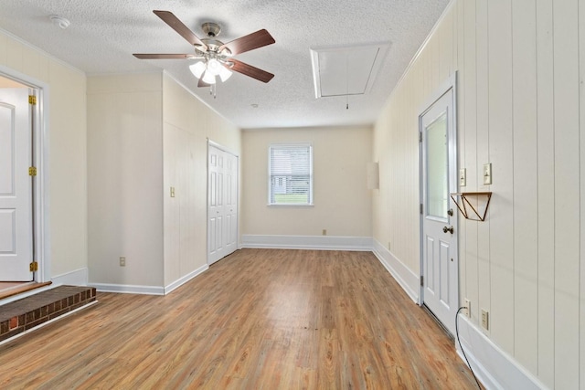 435 Forest St, Lewisburg, TN 37091 - unfurnished bedroom featuring attic access, a textured ceiling, light wood-style floors, ornamental molding, and a ceiling fan