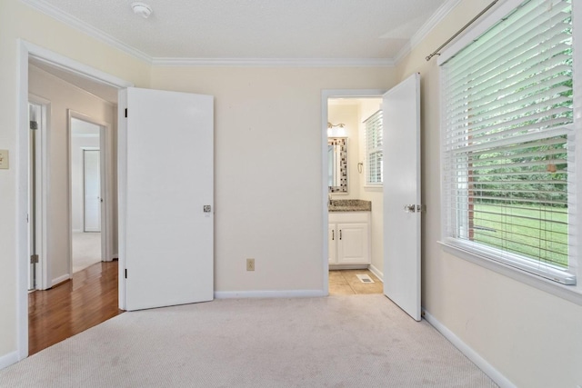 435 Forest St, Lewisburg, TN 37091 - unfurnished bedroom featuring light carpet, ornamental molding, and connected bathroom