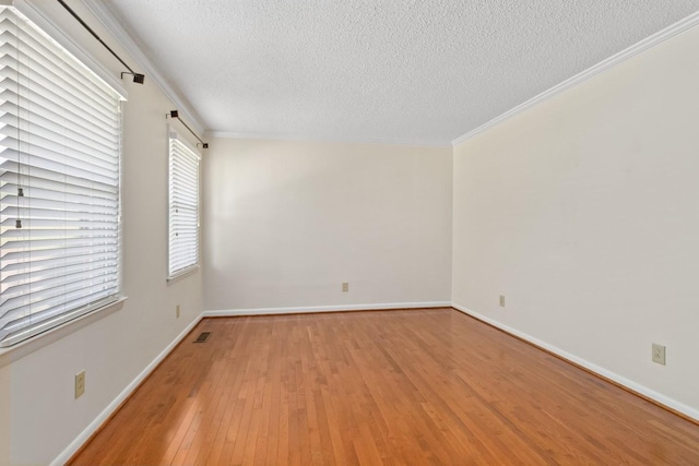 435 Forest St, Lewisburg, TN 37091 - spare room featuring a textured ceiling, light wood-style flooring, and crown molding