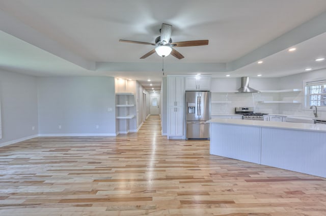 1059 S Cross Bridges Rd, Mount Pleasant, TN 38474 - kitchen with stainless steel appliances, wall chimney exhaust hood, open shelves, a ceiling fan, and light countertops