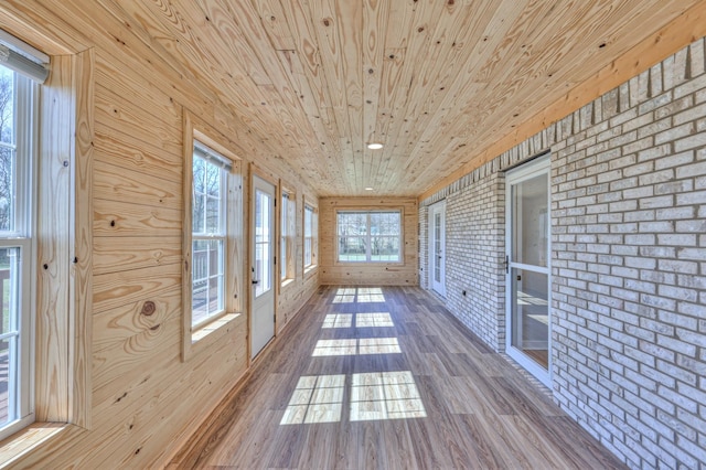 1059 S Cross Bridges Rd, Mount Pleasant, TN 38474 - unfurnished sunroom featuring brick wall, wood ceiling, hardwood / wood-style floors, and wood walls