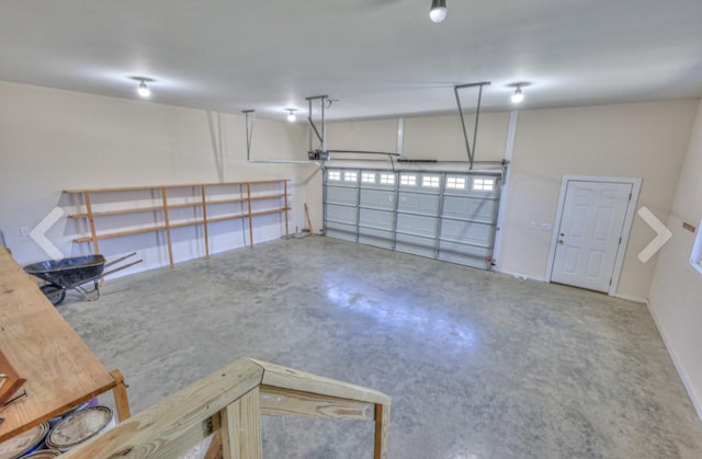 1059 S Cross Bridges Rd, Mount Pleasant, TN 38474 - garage featuring a garage door opener and baseboards