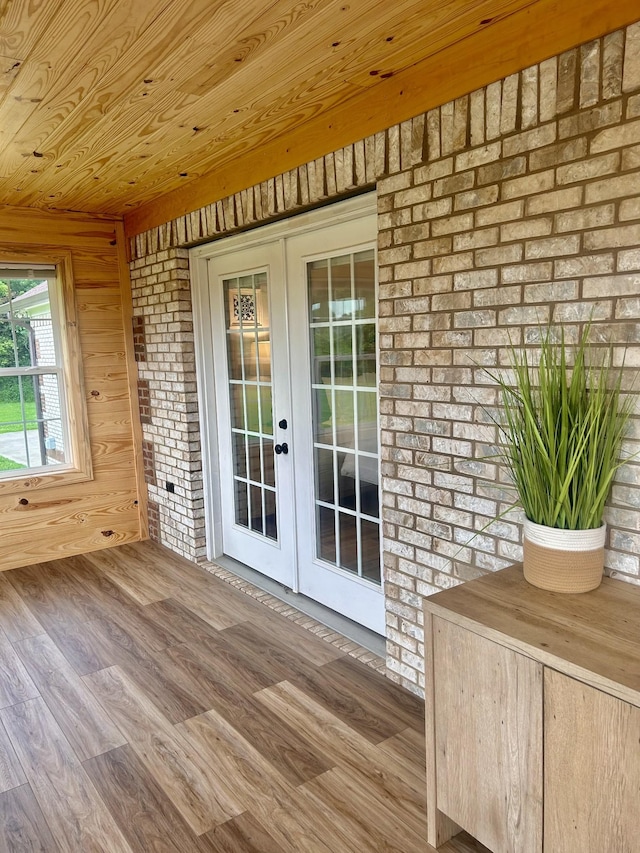 1059 S Cross Bridges Rd, Mount Pleasant, TN 38474 - doorway featuring french doors, wood finished floors, wood ceiling, and brick wall