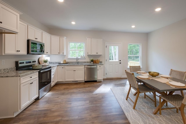 766 Billy Wynn Rd, Dickson, TN 37055 - kitchen featuring appliances with stainless steel finishes, recessed lighting, dark wood-type flooring, white cabinets, and light stone countertops