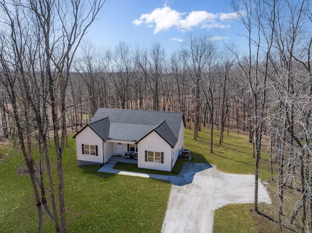 762 Billy Wynn Rd, Dickson, TN 37055 - view of front of property featuring driveway, roof with shingles, a front yard, and stucco siding