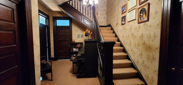 704 Main St N, Carthage, TN 37030 - stairway with carpet, a chandelier, and wallpapered walls