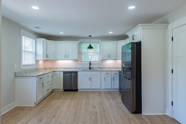 4893 Rainer Dr, Old Hickory, TN 37138 - kitchen featuring dishwasher, fridge with ice dispenser, white cabinets, plenty of natural light, and recessed lighting
