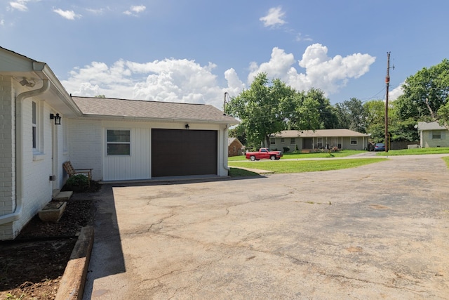 4893 Rainer Dr, Old Hickory, TN 37138 - view of home's exterior with driveway, brick siding, and a garage