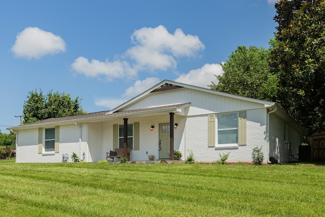 4893 Rainer Dr, Old Hickory, TN 37138 - ranch-style home with brick siding, a front yard, and covered porch