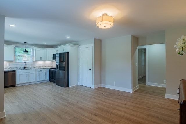 4893 Rainer Dr, Old Hickory, TN 37138 - kitchen featuring appliances with stainless steel finishes, white cabinetry, light wood-type flooring, hanging light fixtures, and recessed lighting