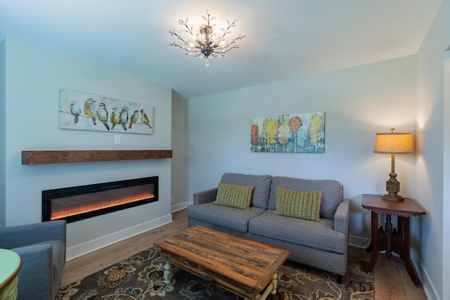 4893 Rainer Dr, Old Hickory, TN 37138 - living room with a glass covered fireplace, wood finished floors, and a chandelier