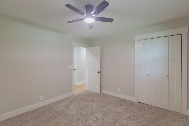 4893 Rainer Dr, Old Hickory, TN 37138 - unfurnished bedroom featuring light colored carpet, a closet, and a ceiling fan