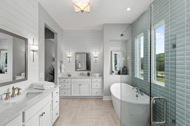 7103A Kyles Creek Dr, Fairview, TN 37062 - bathroom featuring a freestanding bath, two vanities, wooden walls, a shower, and recessed lighting