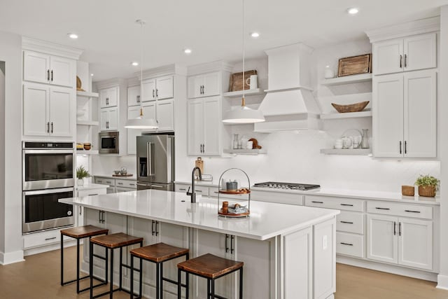 7103A Kyles Creek Dr, Fairview, TN 37062 - kitchen featuring open shelves, appliances with stainless steel finishes, light wood-style floors, white cabinets, and light countertops