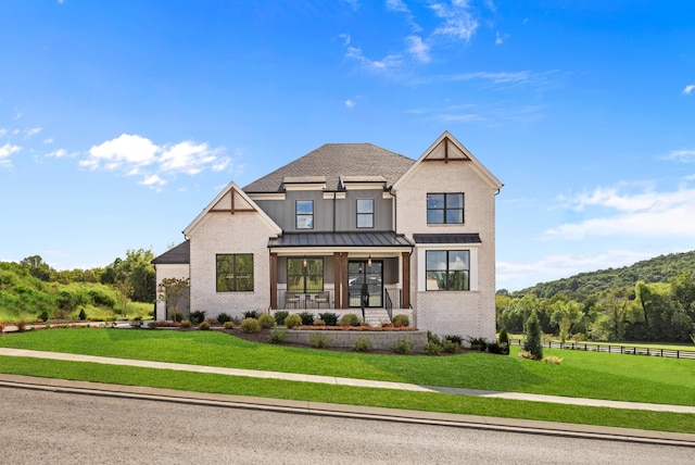 7103A Kyles Creek Dr, Fairview, TN 37062 - modern farmhouse with covered porch, brick siding, a standing seam roof, a metal roof, and roof with shingles