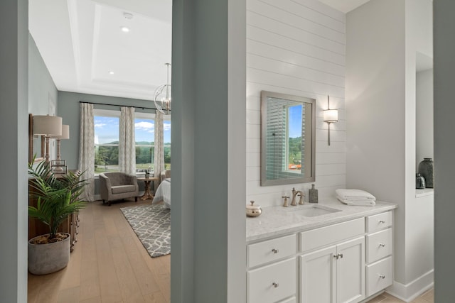 7103A Kyles Creek Dr, Fairview, TN 37062 - bathroom featuring vanity, a tray ceiling, wood finished floors, a chandelier, and recessed lighting