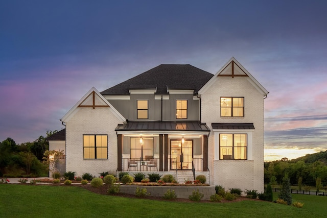 7103A Kyles Creek Dr, Fairview, TN 37062 - view of front of house featuring a porch, brick siding, a standing seam roof, and roof with shingles