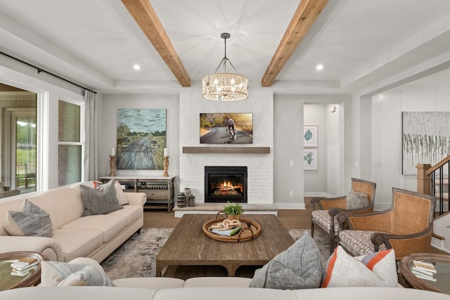 7103A Kyles Creek Dr, Fairview, TN 37062 - living room with wood finished floors, a chandelier, beam ceiling, a brick fireplace, and recessed lighting