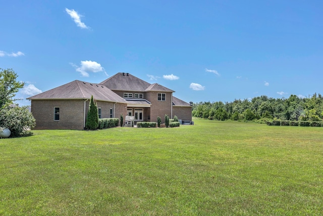 3699 Sweethome Rd, Ashland City, TN 37015 - back of house with a lawn and brick siding