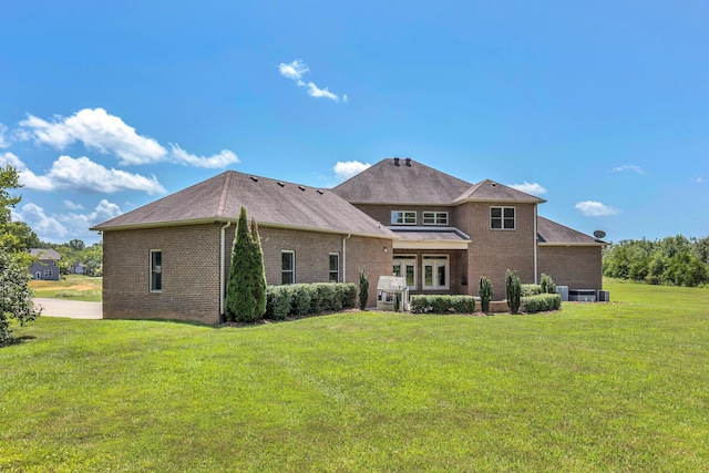 3699 Sweethome Rd, Ashland City, TN 37015 - back of property with brick siding and a yard