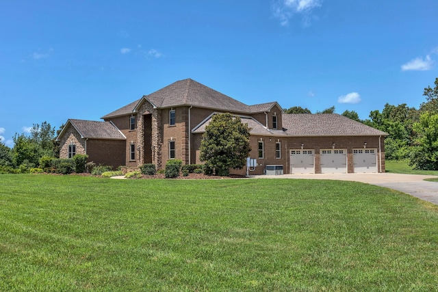3699 Sweethome Rd, Ashland City, TN 37015 - view of front of property with concrete driveway, brick siding, a front yard, and a garage