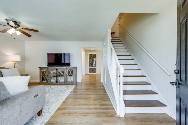 1018 Lowrey Pl, Spring Hill, TN 37174 - living room featuring stairs, ceiling fan, and light wood-style flooring