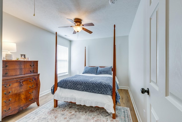 1018 Lowrey Pl, Spring Hill, TN 37174 - bedroom featuring light wood-type flooring, a textured ceiling, and a ceiling fan