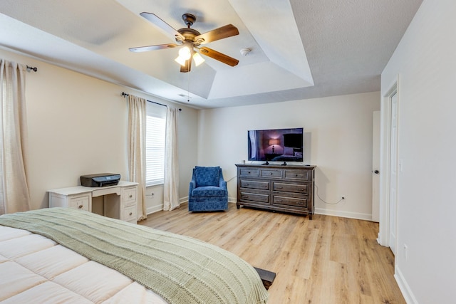 1018 Lowrey Pl, Spring Hill, TN 37174 - bedroom featuring a tray ceiling, light wood-style floors, and ceiling fan