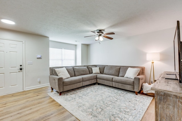 1018 Lowrey Pl, Spring Hill, TN 37174 - living room with ceiling fan, light wood-type flooring, and a textured ceiling