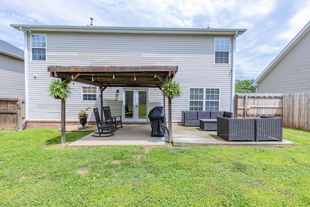 1018 Lowrey Pl, Spring Hill, TN 37174 - rear view of property with french doors, outdoor lounge area, a fenced backyard, and a patio