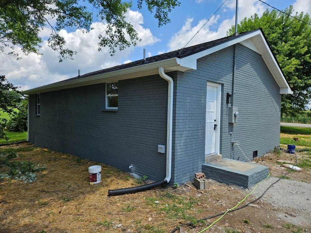 2315 Williamsport Pike, Columbia, TN 38401 - view of side of property with brick siding and crawl space