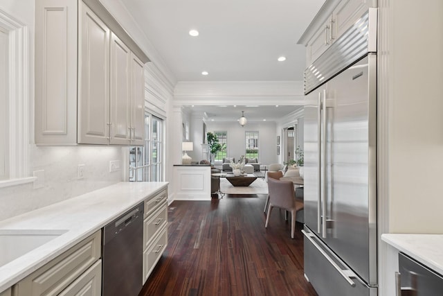 3600 Colewood Dr, Nashville, TN 37215 - kitchen featuring appliances with stainless steel finishes, open floor plan, ornamental molding, dark wood-style floors, and recessed lighting