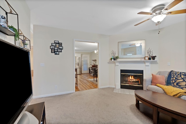 1438 Anita Ct, Murfreesboro, TN 37130 - living area with carpet floors, a ceiling fan, and a fireplace with flush hearth