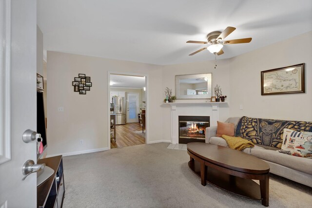 1438 Anita Ct, Murfreesboro, TN 37130 - living room featuring carpet, a ceiling fan, and a fireplace with flush hearth