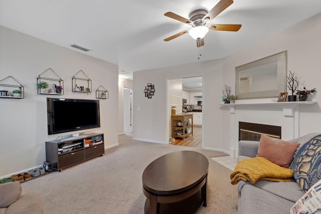 1438 Anita Ct, Murfreesboro, TN 37130 - living area with a ceiling fan, carpet flooring, and a glass covered fireplace