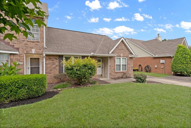1438 Anita Ct, Murfreesboro, TN 37130 - view of front of home featuring brick siding, a front lawn, and a shingled roof