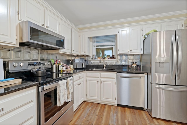 1438 Anita Ct, Murfreesboro, TN 37130 - kitchen with stainless steel appliances, white cabinets, crown molding, and decorative backsplash