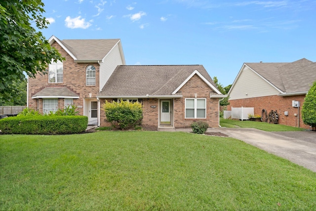 1438 Anita Ct, Murfreesboro, TN 37130 - view of front facade featuring a front lawn, brick siding, and a shingled roof
