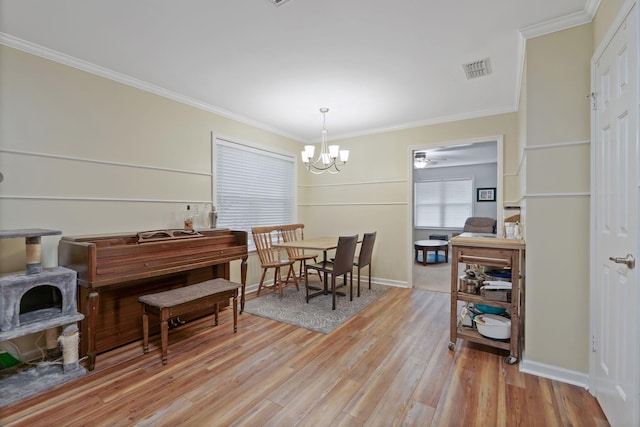 1438 Anita Ct, Murfreesboro, TN 37130 - dining space featuring a chandelier, ornamental molding, and wood finished floors