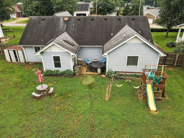 206 Cross Valley Dr, Columbia, TN 38401 - rear view of house with a shingled roof and a storage shed