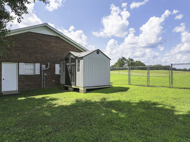127 Fisherdale Dr, Decaturville, TN 38329 - view of yard featuring a gate and a storage unit