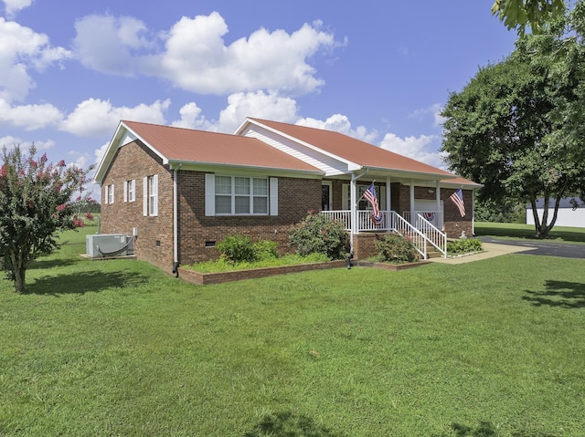 127 Fisherdale Dr, Decaturville, TN 38329 - ranch-style home featuring brick siding, crawl space, a front yard, a porch, and a metal roof