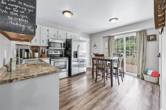 261 Golden Pond Ave, Oak Grove, KY 42262 - kitchen with appliances with stainless steel finishes, wood finished floors, and white cabinetry