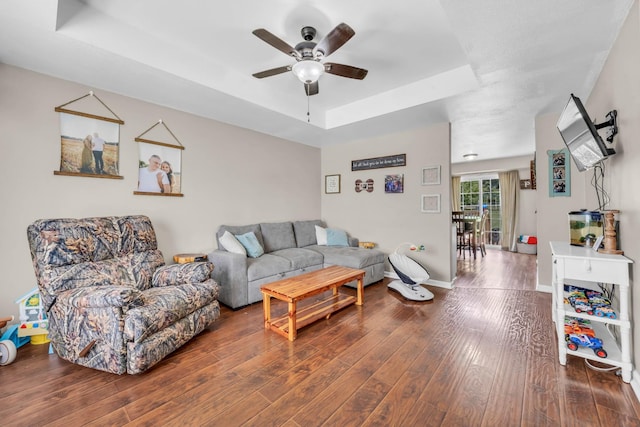 261 Golden Pond Ave, Oak Grove, KY 42262 - living area featuring a tray ceiling, a ceiling fan, and wood finished floors