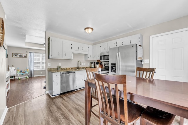 261 Golden Pond Ave, Oak Grove, KY 42262 - kitchen with appliances with stainless steel finishes, dark wood finished floors, and white cabinets